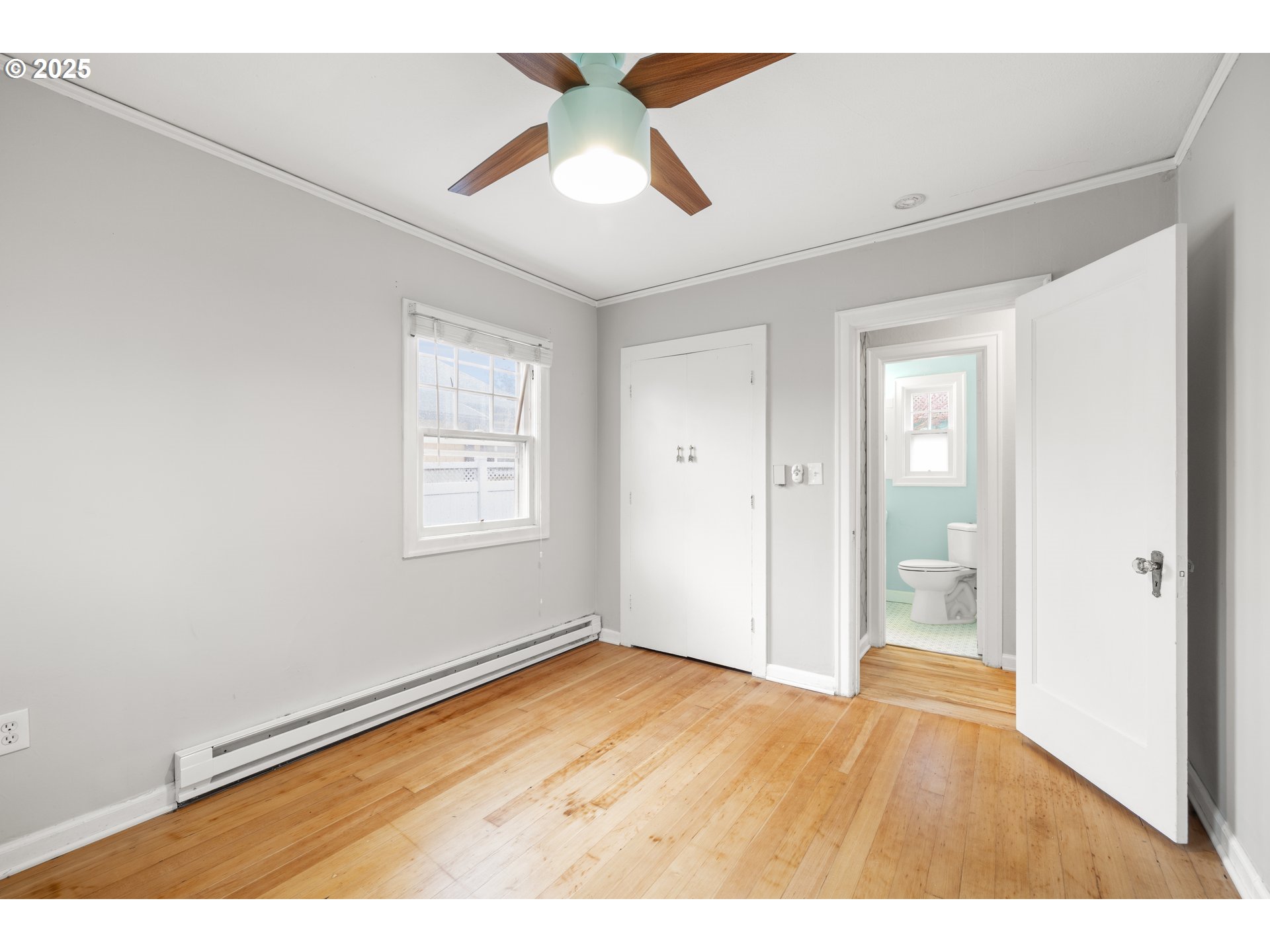 7104 Southeast Tolman Street Portland, OR 97206 - Photo 17 of 34 a view of an empty room and window with a kitchen