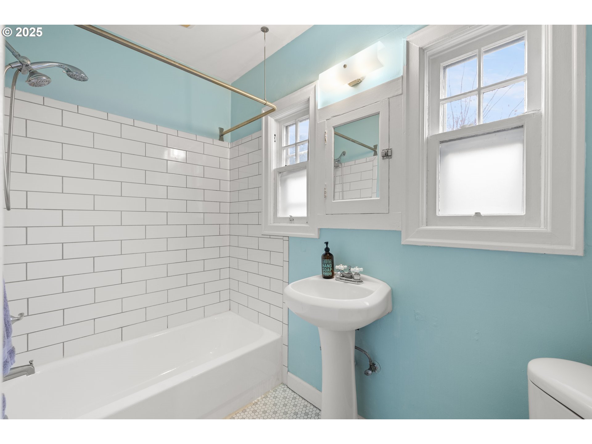 7104 Southeast Tolman Street Portland, OR 97206 - Photo 18 of 34 a bathroom with a sink a mirror and bathtub