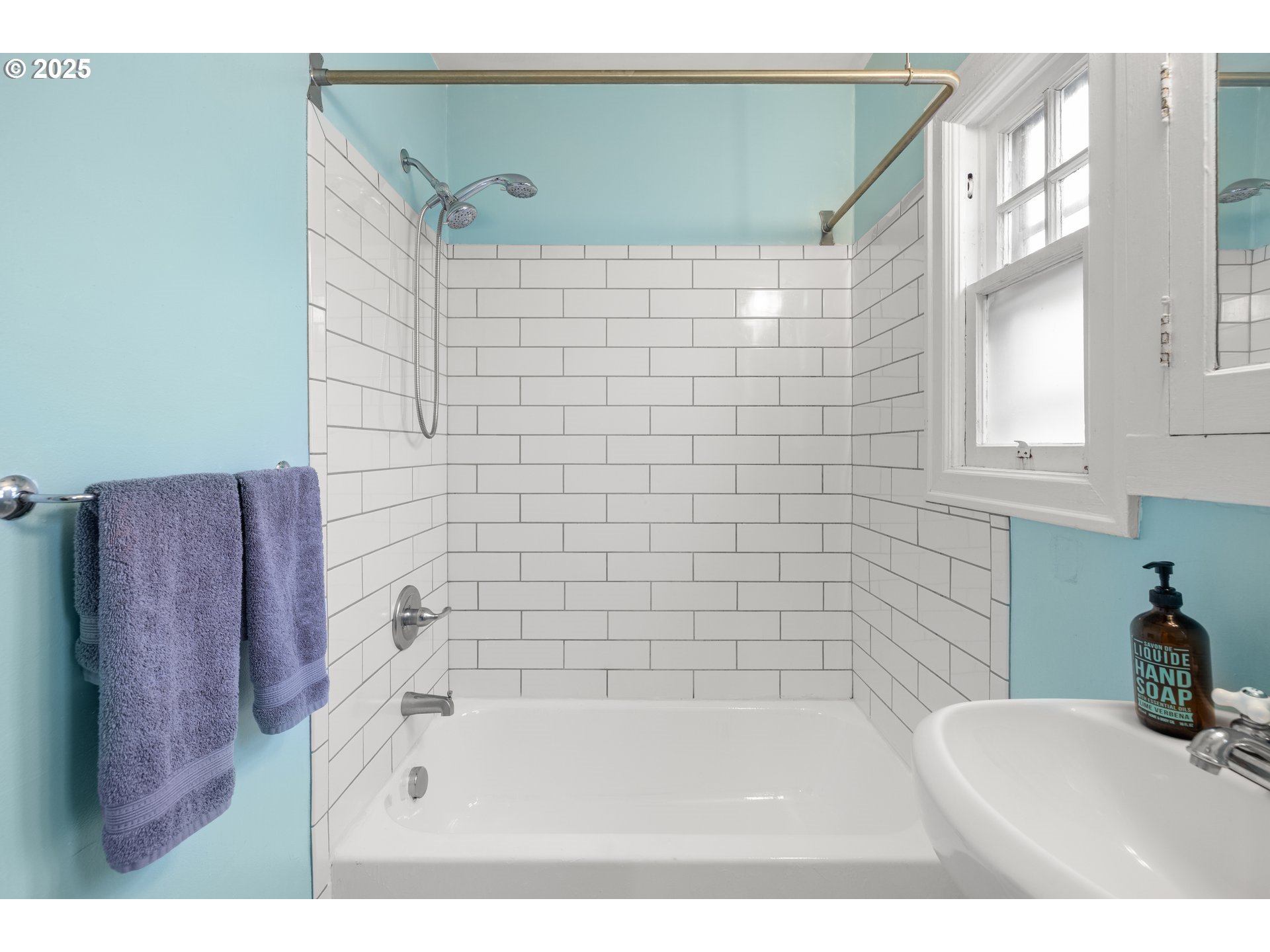 7104 Southeast Tolman Street Portland, OR 97206 - Photo 19 of 34 a bathroom with a bathtub and a shower