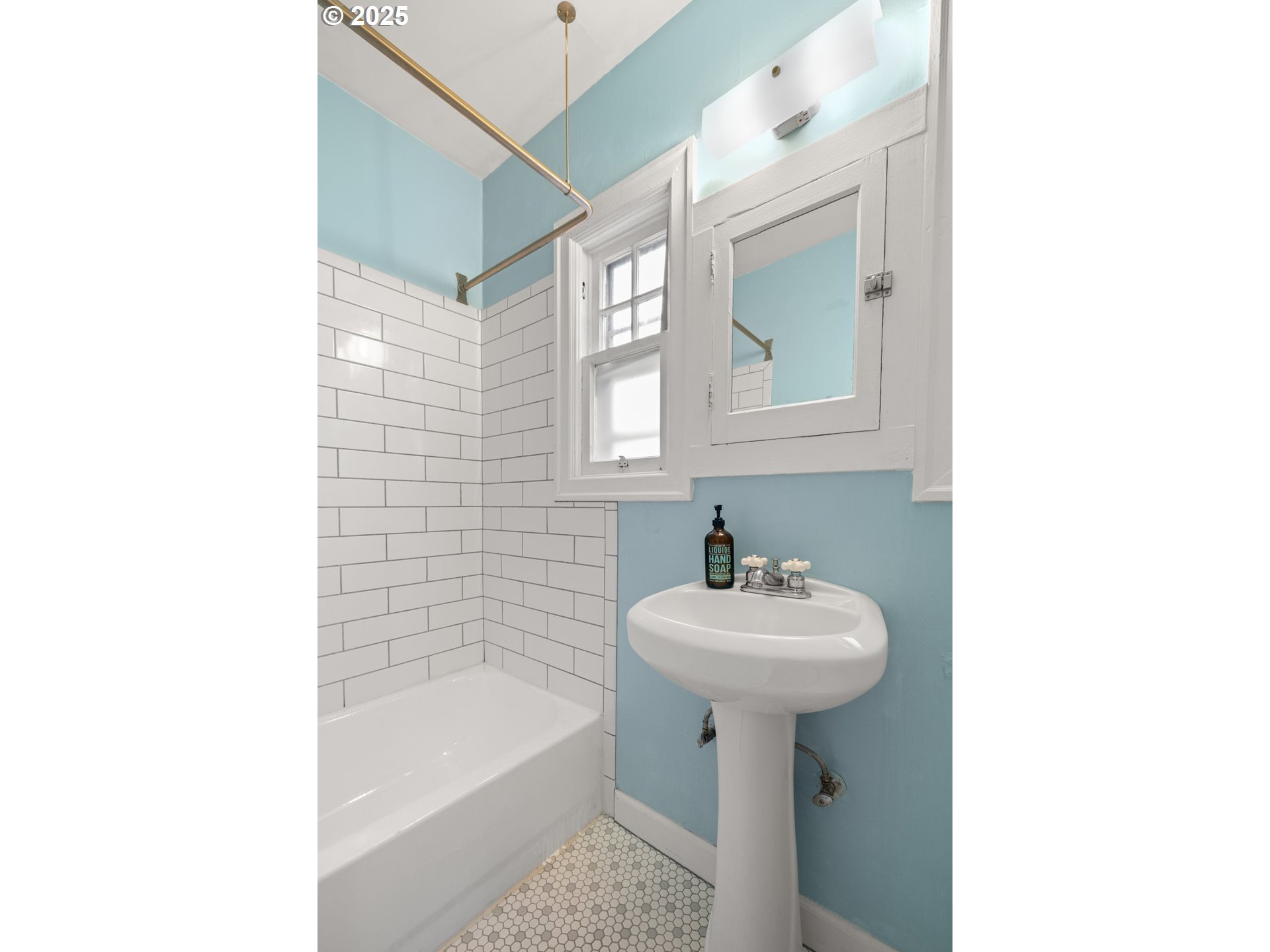 7104 Southeast Tolman Street Portland, OR 97206 - Photo 20 of 34 a bathroom with a sink a mirror and a bathtub