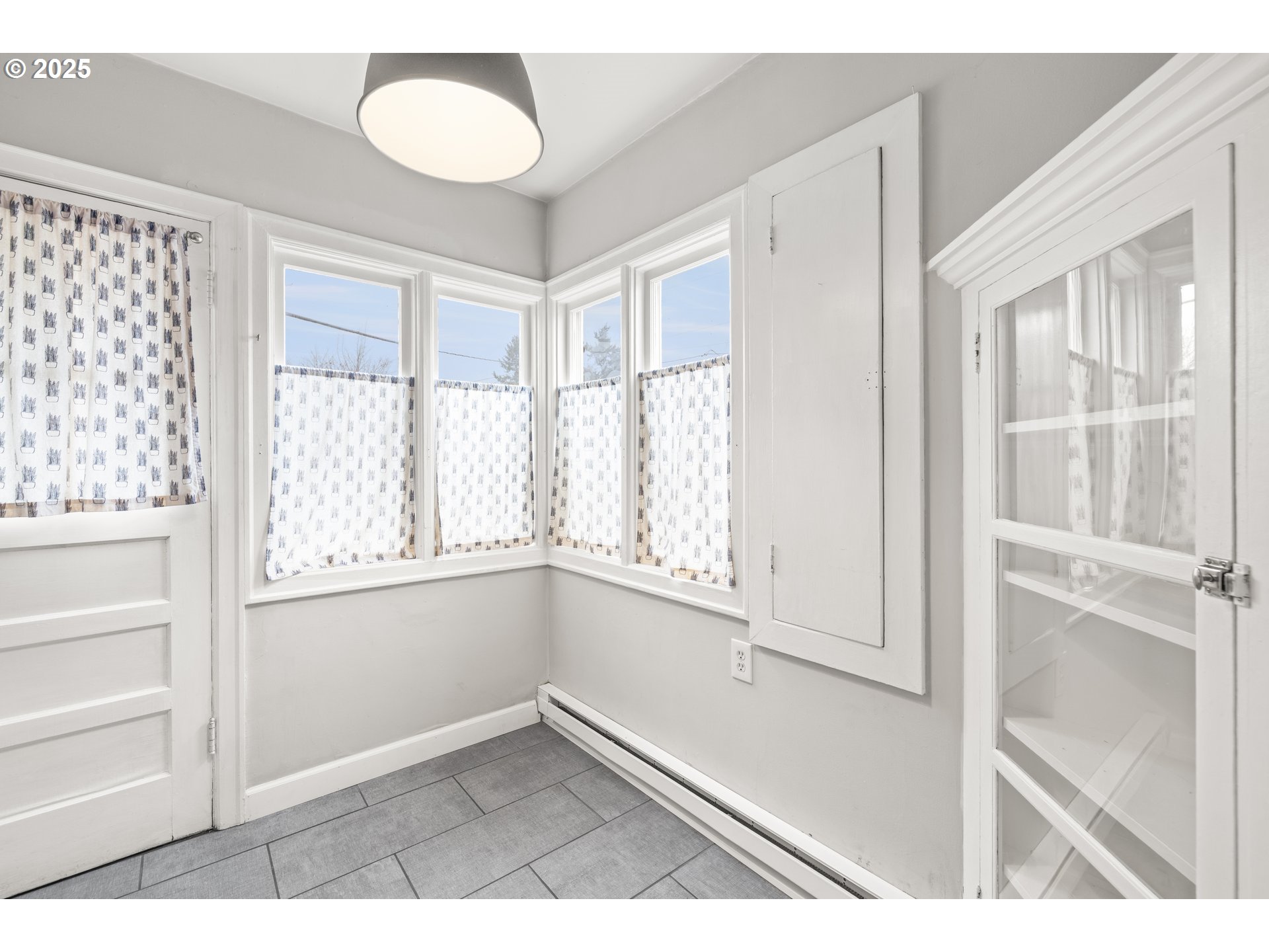 7104 Southeast Tolman Street Portland, OR 97206 - Photo 10 of 34 a view of an empty room with a window