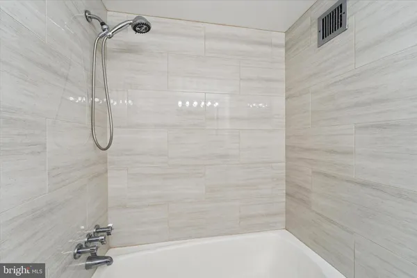 a bathroom with a bath tub