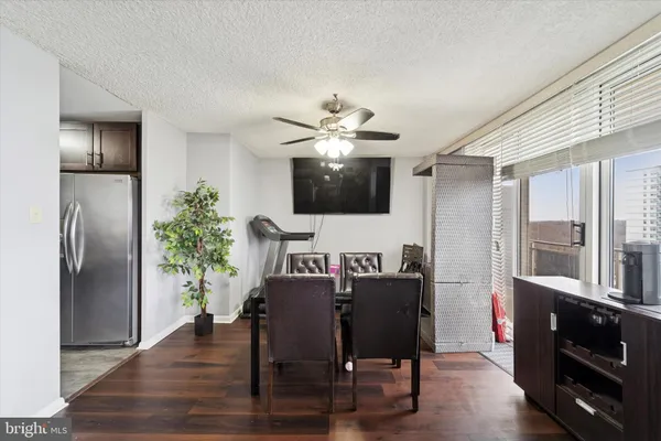a view of a dining room with furniture window and wooden floor