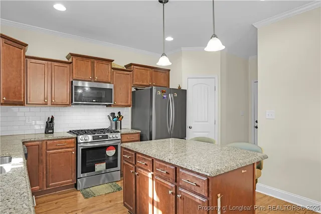 a view of a workspace with furniture and a ceiling fan