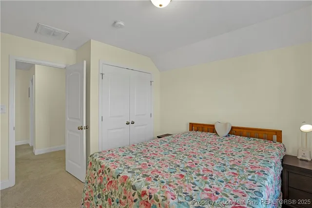 a bathroom with a toilet and a shower curtain