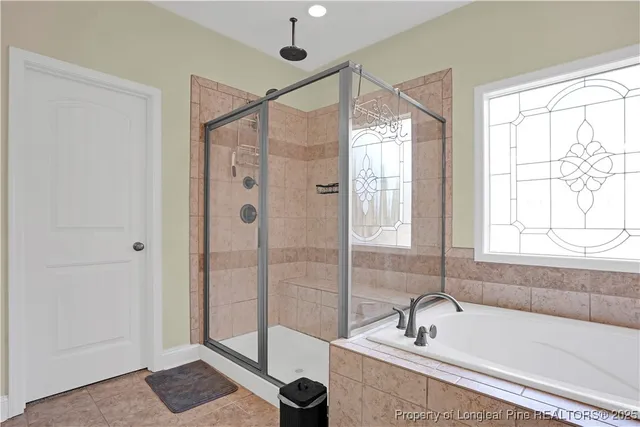 a view of a livingroom with workspace and a window