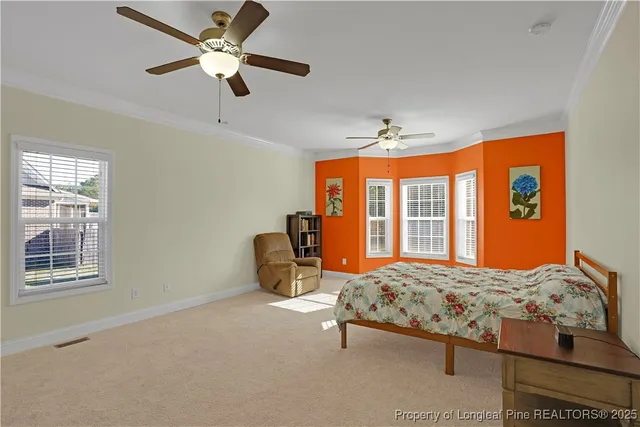 a view of a white house with a swimming pool