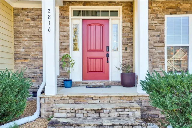 a view of livingroom with furniture wooden floor and windows