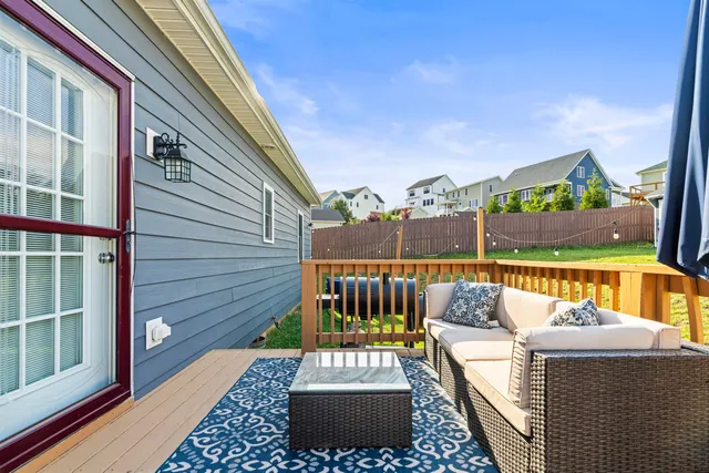 a view of a two chairs in the balcony