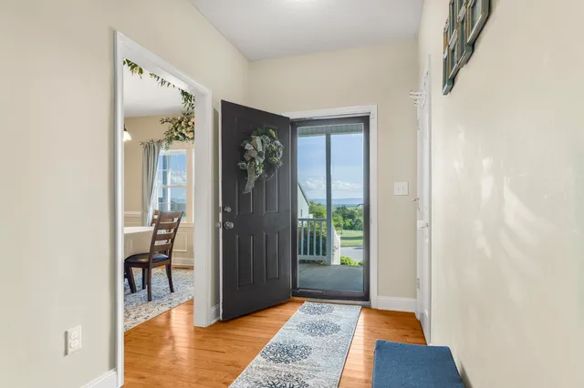 a view of livingroom with furniture and front door