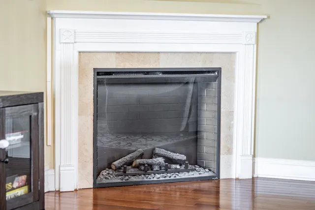 a living room with a fireplace
