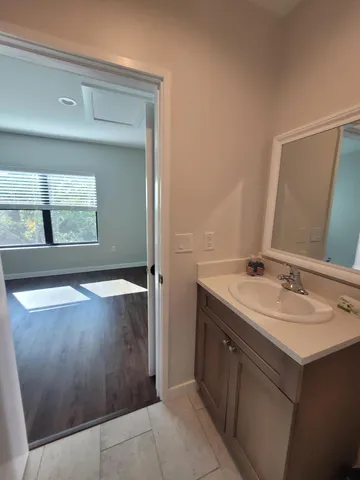 a bathroom with a sink and a mirror