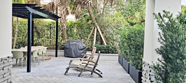 a view of a two chairs in the patio