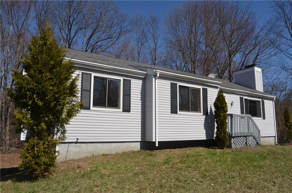 a view of house with backyard