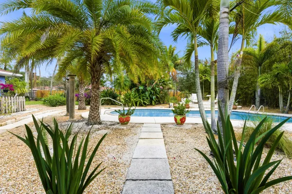 a view of swimming pool with a table and chairs