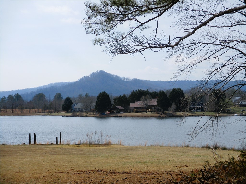 This serene lakefront property offers tranquil water views and mountain vistas.