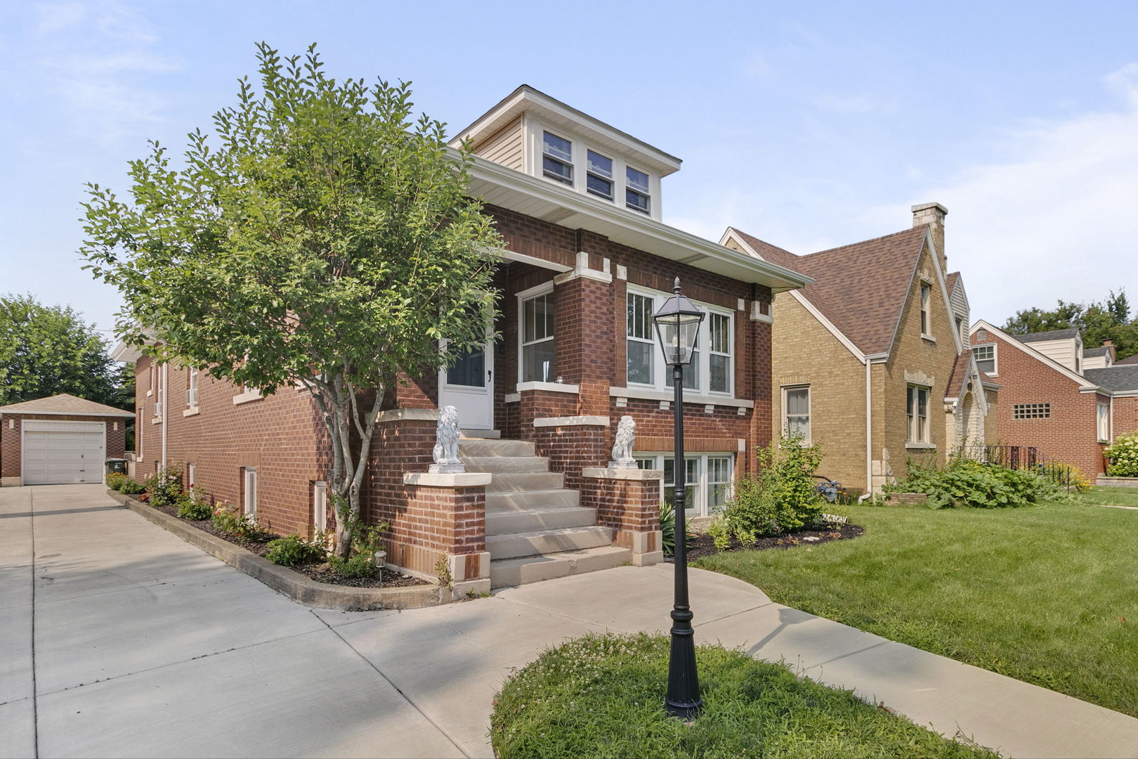 118 Northgate Road Riverside, IL 60546 - Photo 1 of 29 a front view of a house with a yard and trees