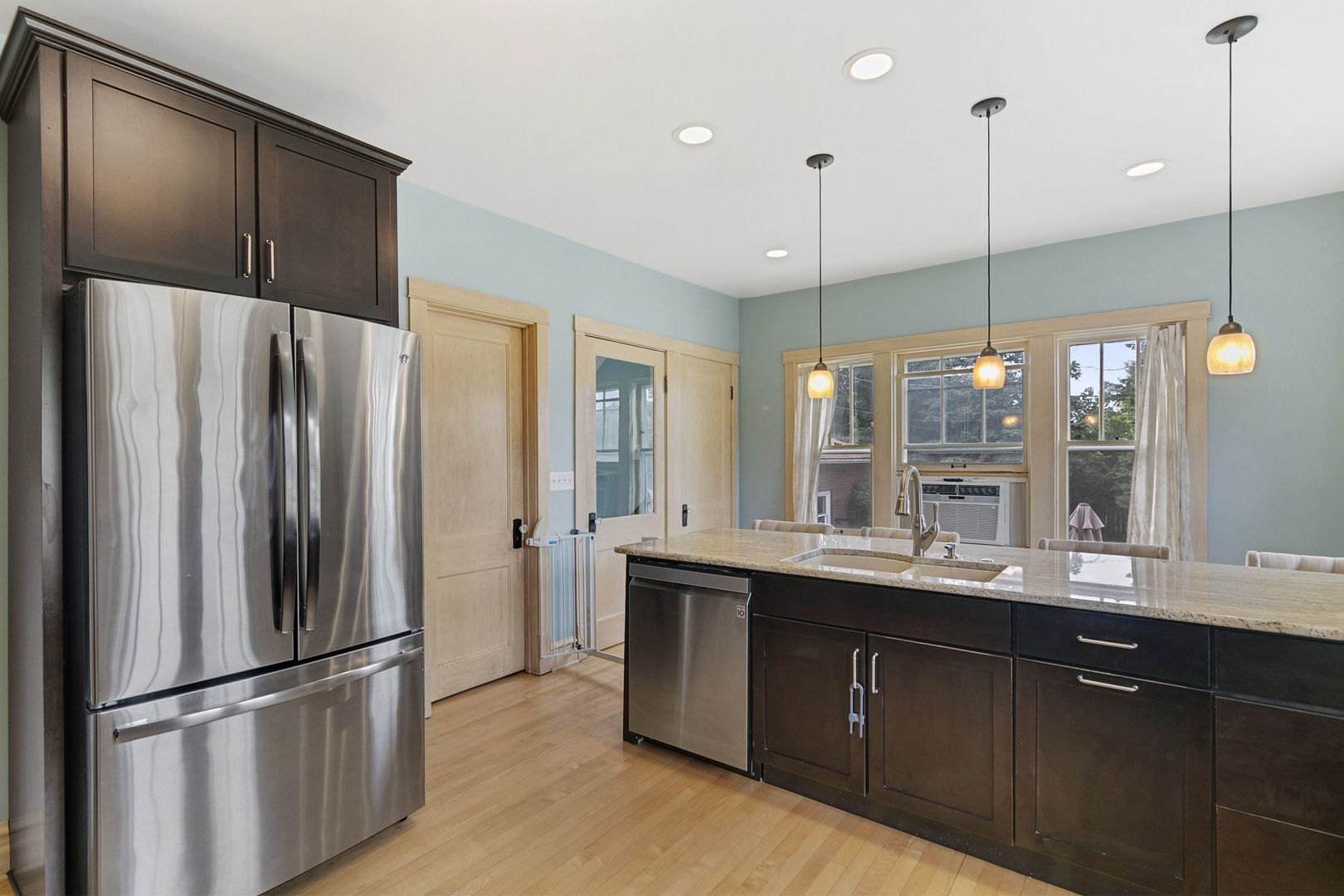 118 Northgate Road Riverside, IL 60546 - Photo 3 of 29 a kitchen with kitchen island a sink appliances and cabinets