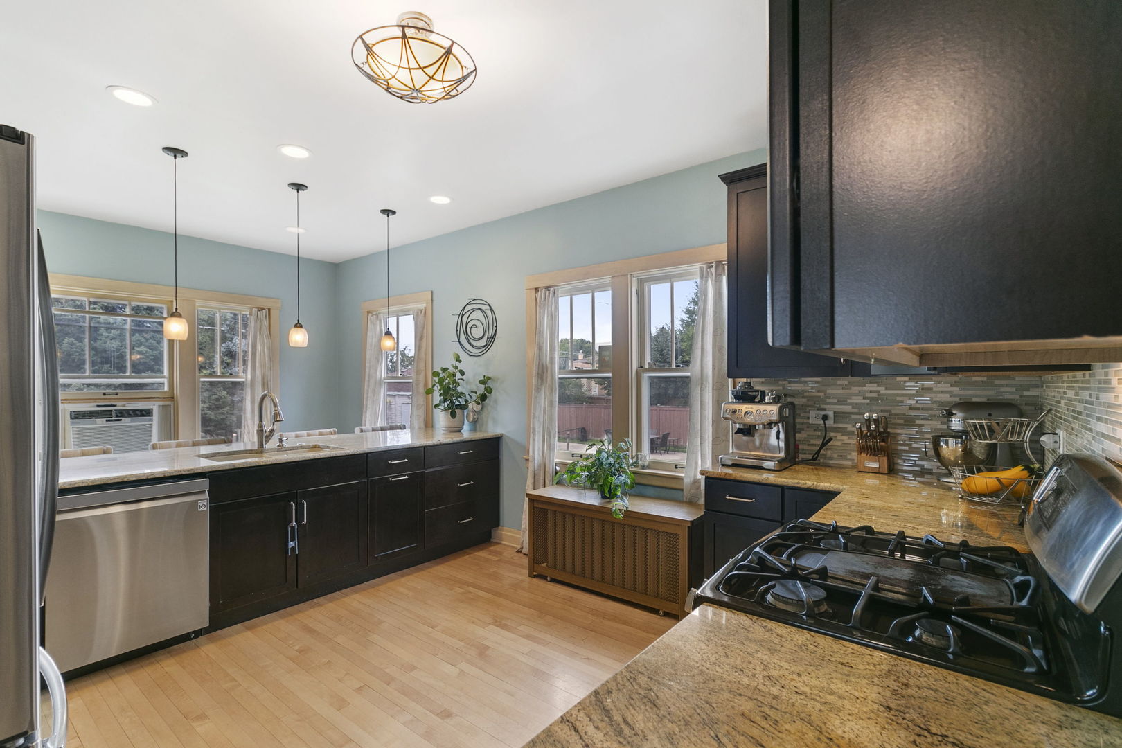 118 Northgate Road Riverside, IL 60546 - Photo 4 of 29 a kitchen with stainless steel appliances granite countertop a stove and a sink