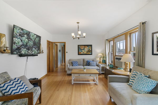 118 Northgate Road Riverside, IL 60546 - Photo 7 of 29 a living room with furniture and a chandelier