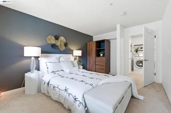 a bedroom with a bed and a table in it