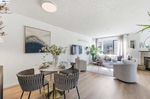 a living room with furniture potted plant and a table