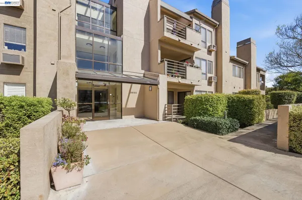 a view of a building with a yard