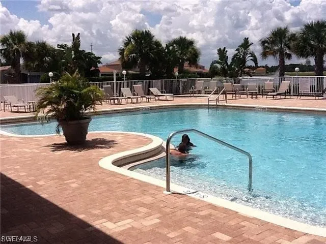 a view of a swimming pool with a patio