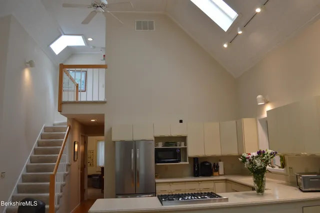 a living room with fireplace furniture and a flat screen tv