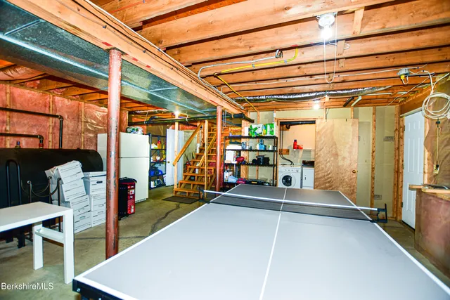 a kitchen with a sink stove and refrigerator
