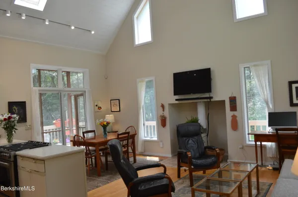 a kitchen with kitchen island a stove a sink and a refrigerator