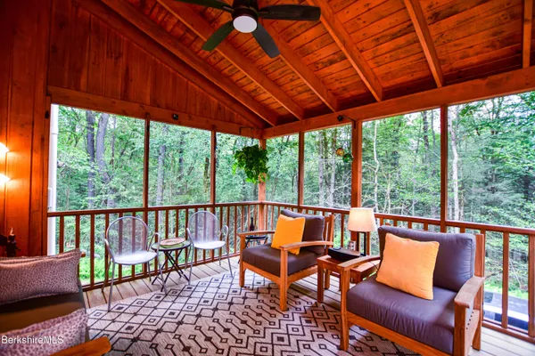 a kitchen with refrigerator and cabinets