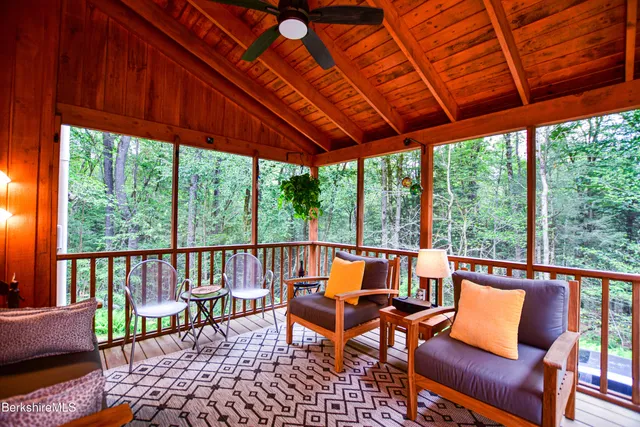 a kitchen with refrigerator and cabinets