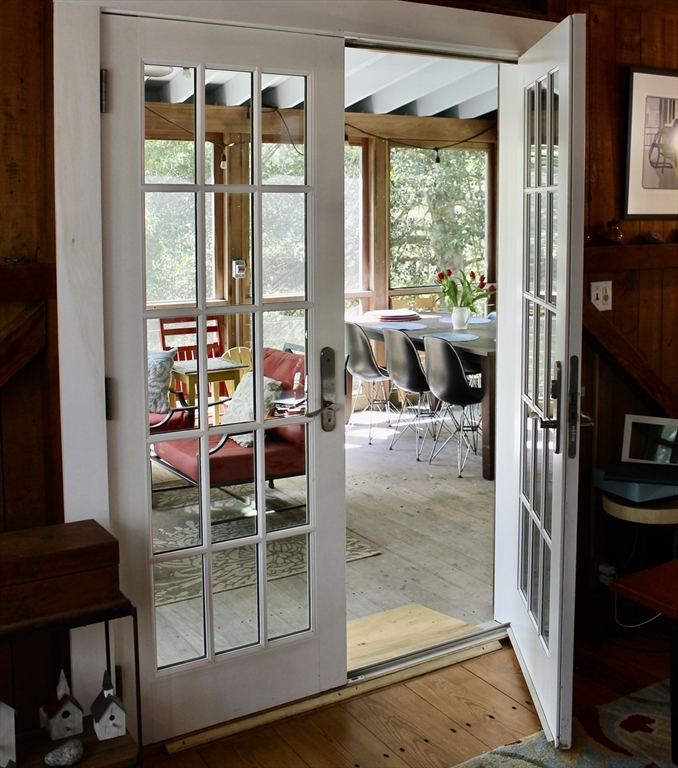 225 Lamberts Cove Road West Tisbury, MA 02568 - Photo 26 of 33 a view of a balcony dining table and chairs