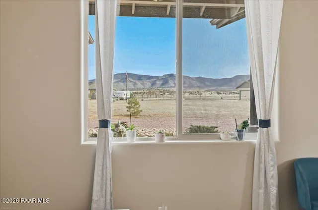 a spacious bedroom with a bed and a table