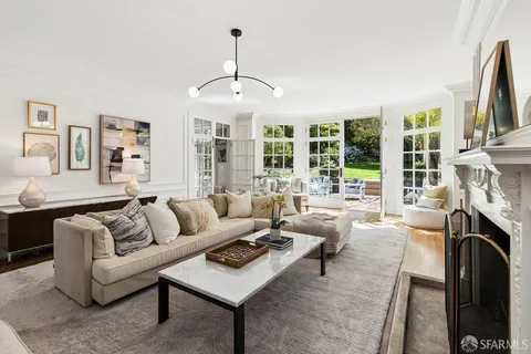 a spacious bedroom with a bed and a cabinets