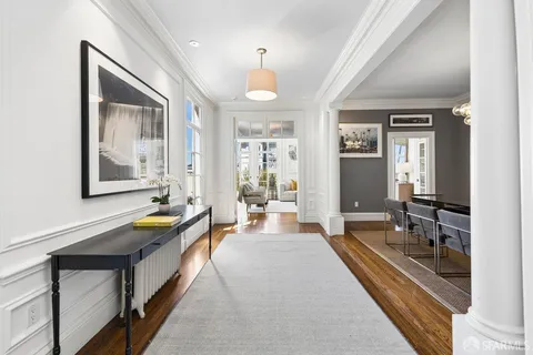 a kitchen with stainless steel appliances a stove top oven