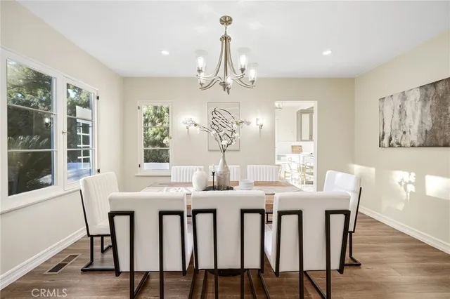 a view of a dining room with furniture and a window