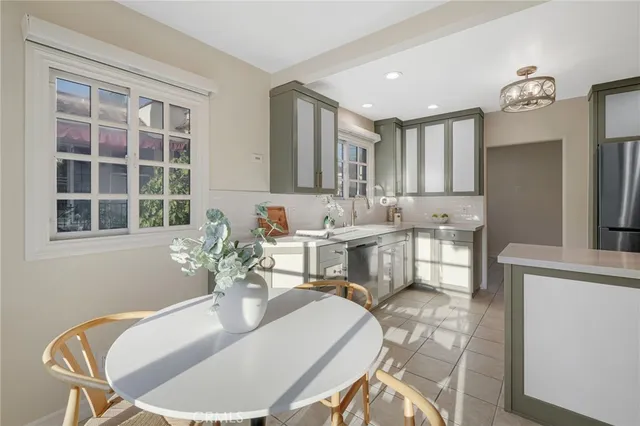 a kitchen with stainless steel appliances granite countertop a stove and a sink