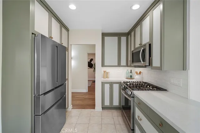 a bedroom with a large bed and a large window