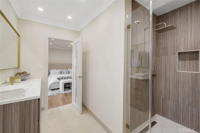 a bedroom with furniture and a potted plant