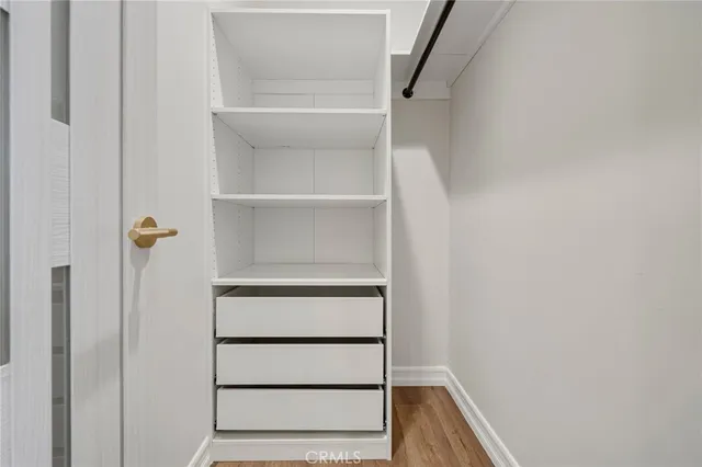 a bathroom with a shower sink and mirror