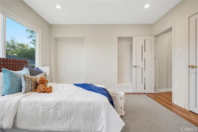 a view of a porch with wooden floor and a potted plant