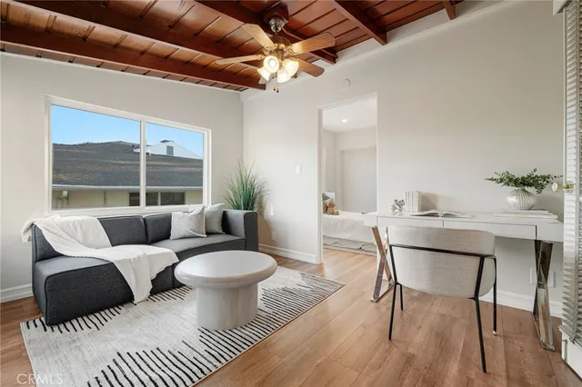 a view of a white house with a yard