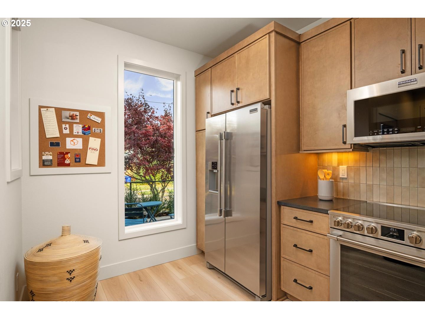 2620 North Kilpatrick Street Portland, OR 97217 - Photo 14 of 37 a kitchen with stainless steel appliances a refrigerator and a stove