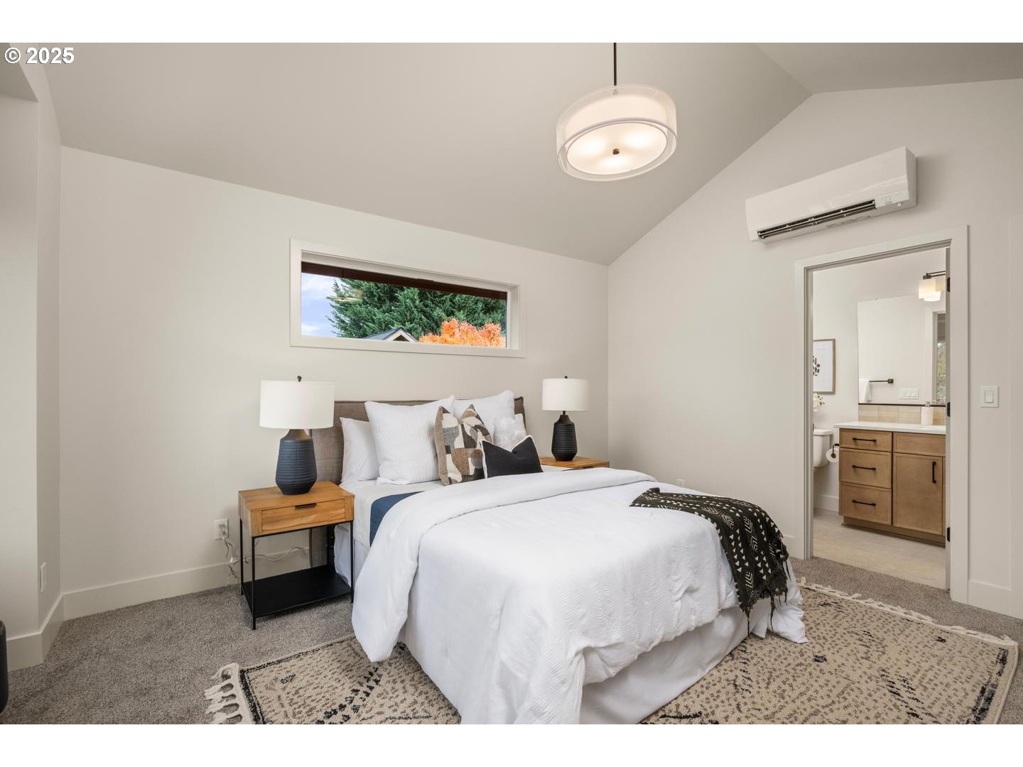 2620 North Kilpatrick Street Portland, OR 97217 - Photo 20 of 37 a bedroom with a bed and a television