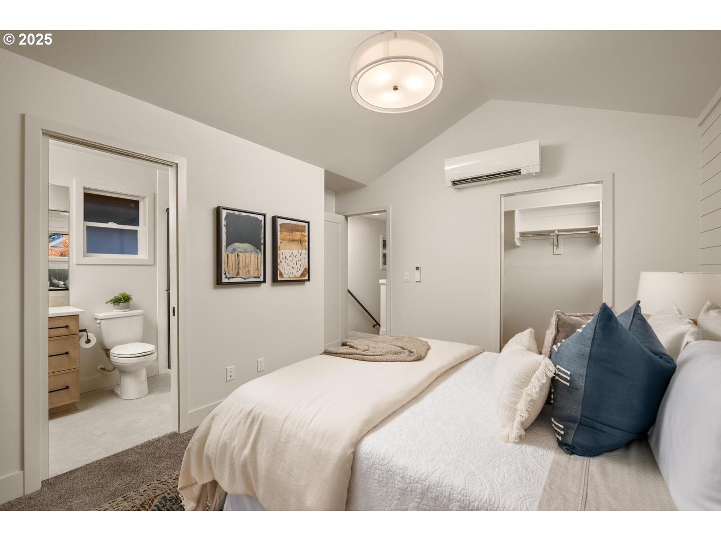 2620 North Kilpatrick Street Portland, OR 97217 - Photo 25 of 37 a bedroom with a bed and a painting