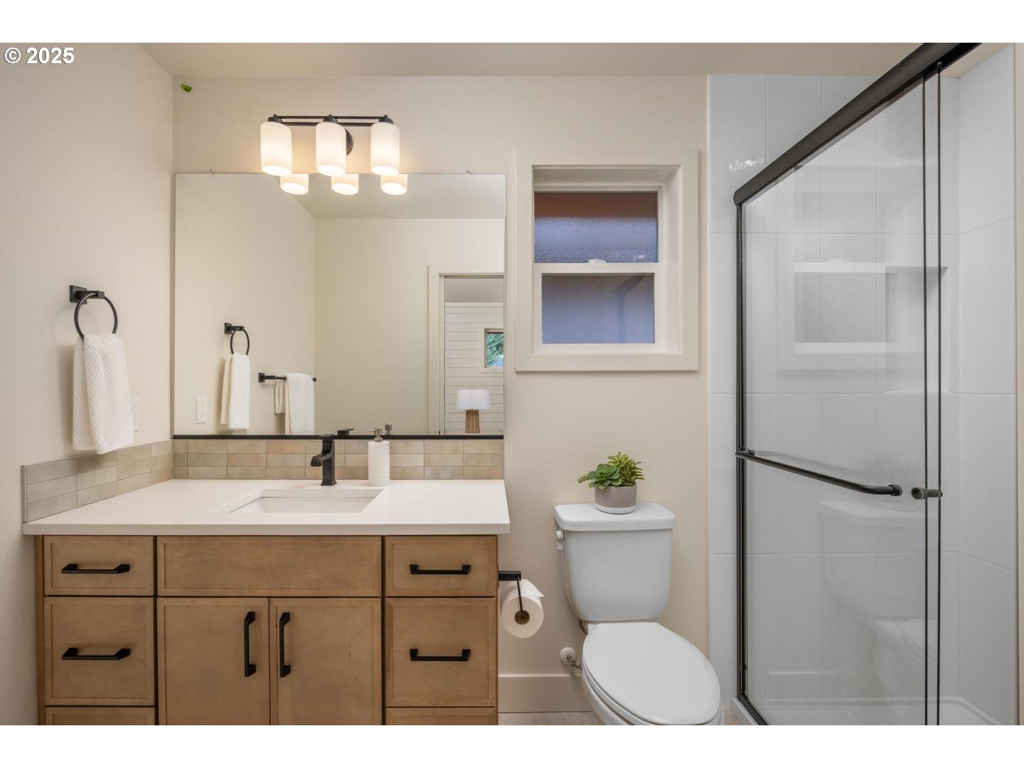 2620 North Kilpatrick Street Portland, OR 97217 - Photo 26 of 37 a bathroom with a sink a toilet and shower