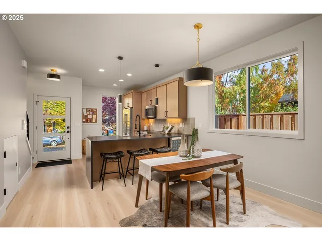 a dining room with furniture and window
