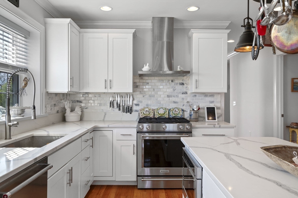 13 Spring Street, Unit 3 Salem, MA 01970 - Photo 11 of 37 a kitchen with a sink stove and cabinets